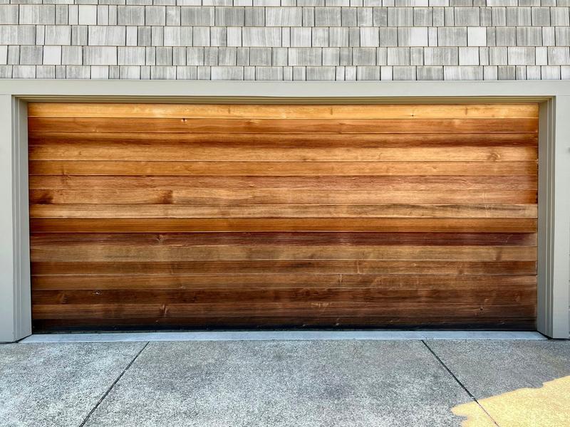 Medium wood door, horizontal planks, double door, in a shingle wall