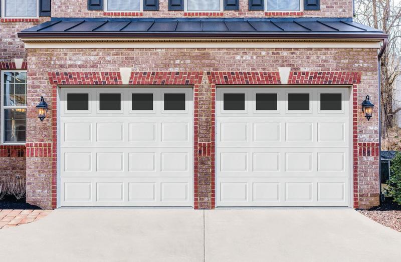 White raised panel door, short panels, top windows, two single doors, in a brick wall
