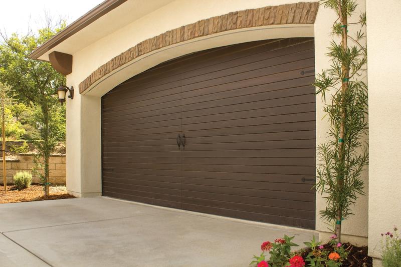 Dark wood plank door, horizontal planks, double door, in a stucco wall