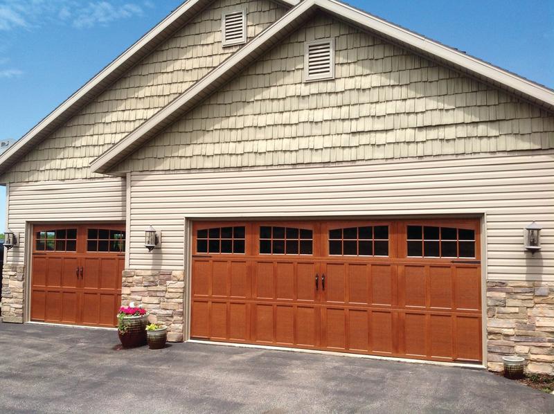 Medium wood carriage door, arched windows, two single doors, in a shingle wall