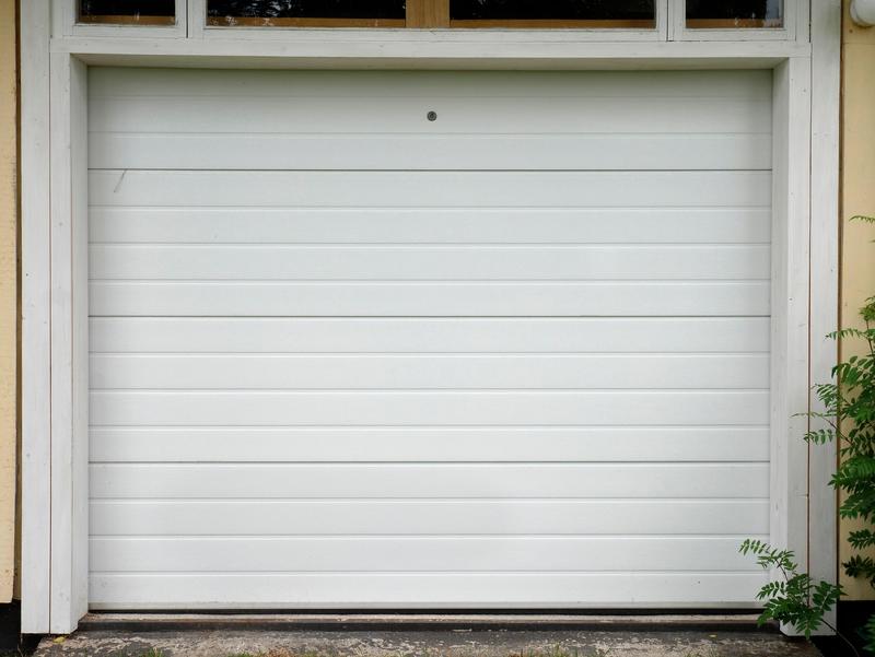 White flat door, fine ribs, single door, in a painted board wall