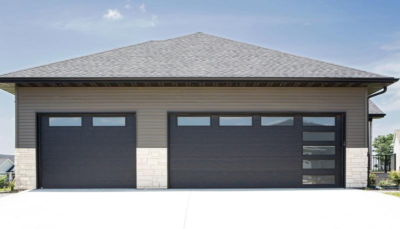 Charcoal flat door, top windows, side window slits, two single doors, in a lap siding wall