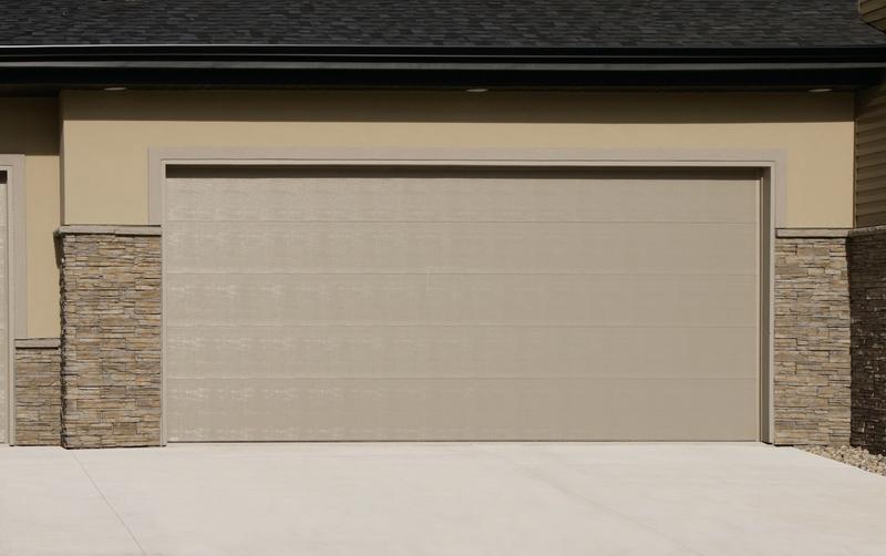 Sandtone flat door, smooth, double door, in a stucco wall