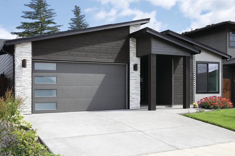 Charcoal flat door, side window slits, on a modern home, double door, in a wood siding wall