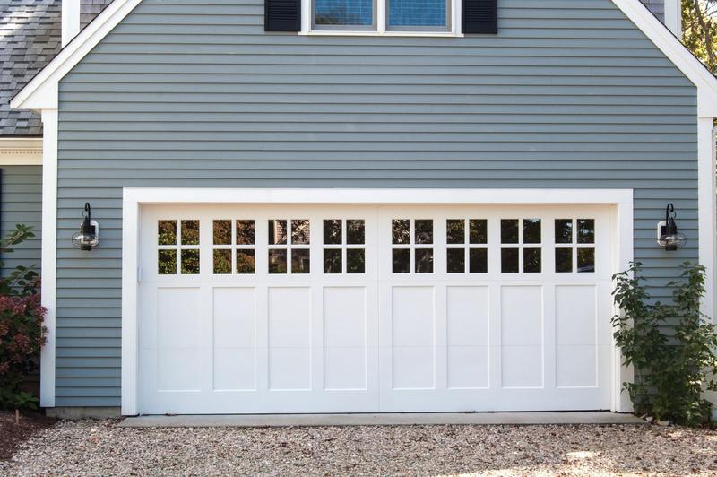 Painted wood door, square windows, double door, in a lap siding wall