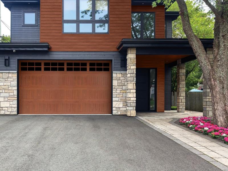 Medium wood plank door, top windows, on a modern home, double door, in a stone wall