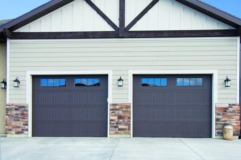 Brown raised panel door, grooved panels, top windows, two single doors, in a lap siding wall