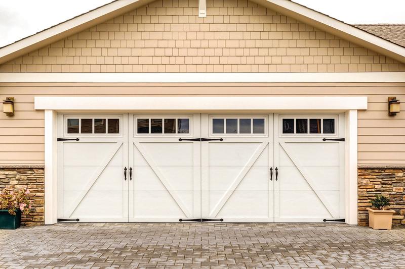 White carriage door, Z brace, square windows, double door, in a shingle wall