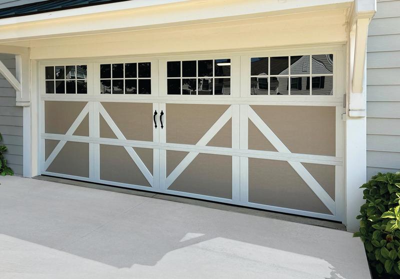 Sandtone carriage door, X braces, square windows, double door, in a lap siding wall