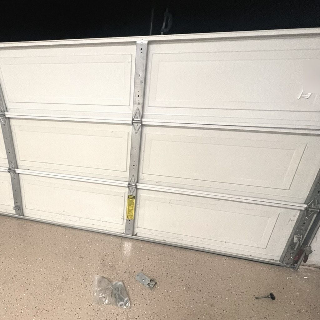 A technician checking a garage door