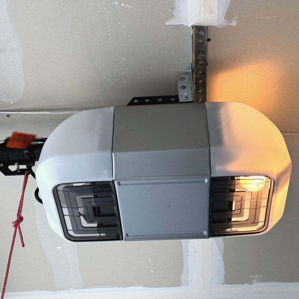 A garage door opener on a ceiling