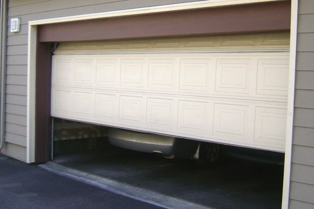 A garage door stuck part-way open