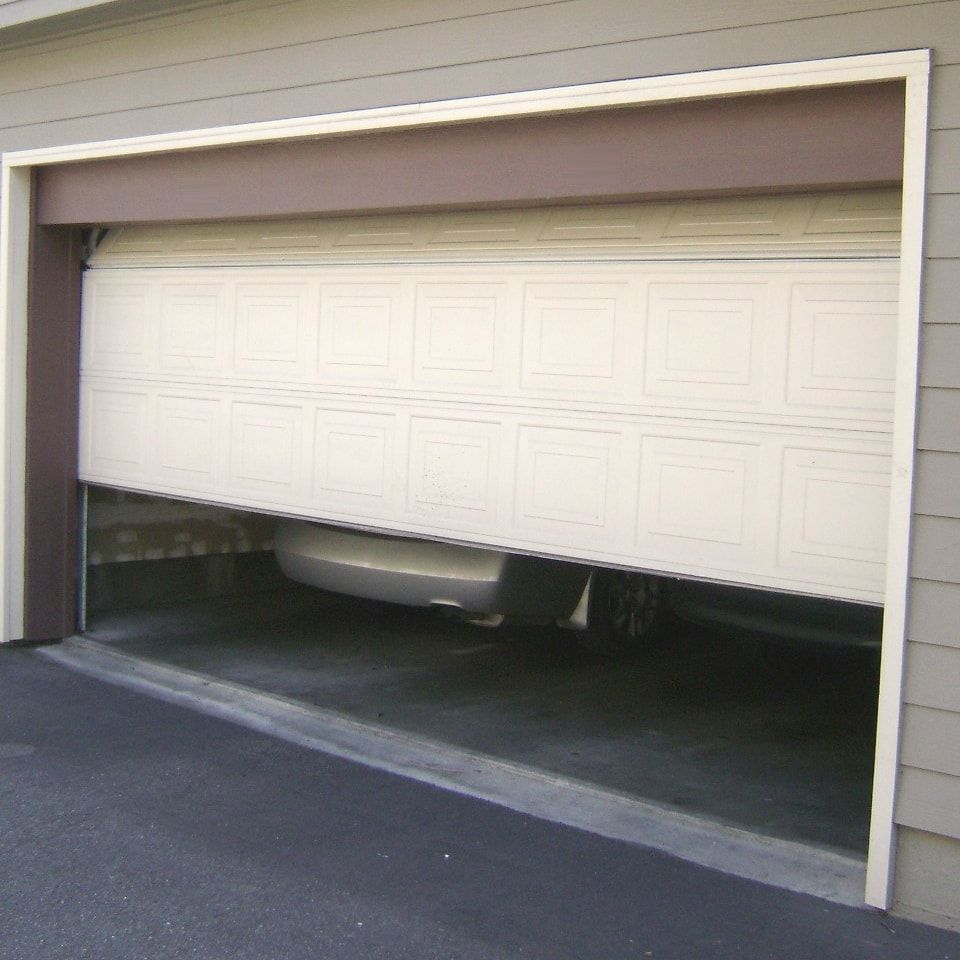 A garage door stuck part-way open