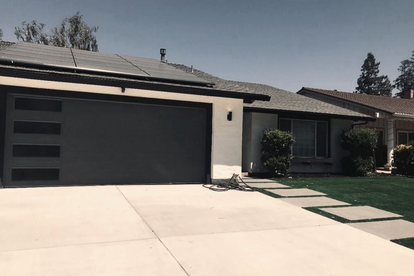 A new sectional garage door on a house