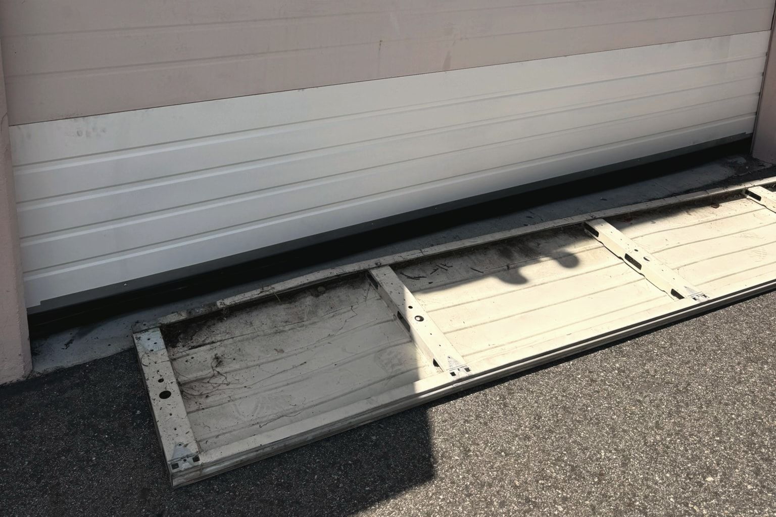 A new bottom section installed, the damaged one on the ground